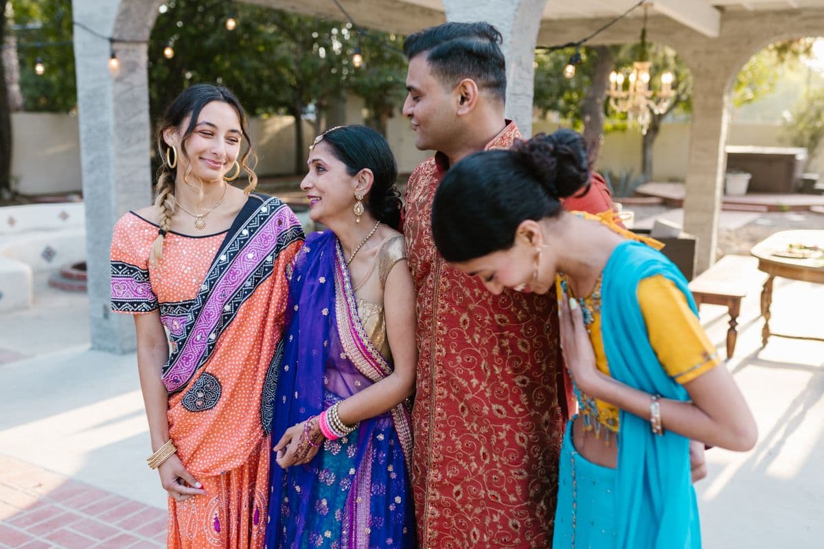 Group of friends in traditional Indian attire at a gathering